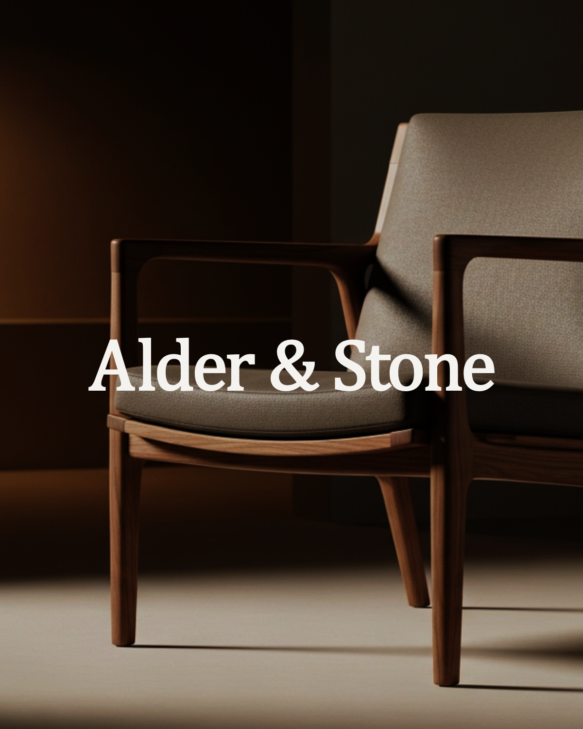 Dark, moody armchair photography with the Alder & Stone wordmark