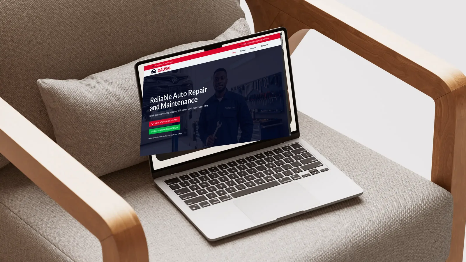 Laptop on an armchair showing the Dausal auto repair website homepage