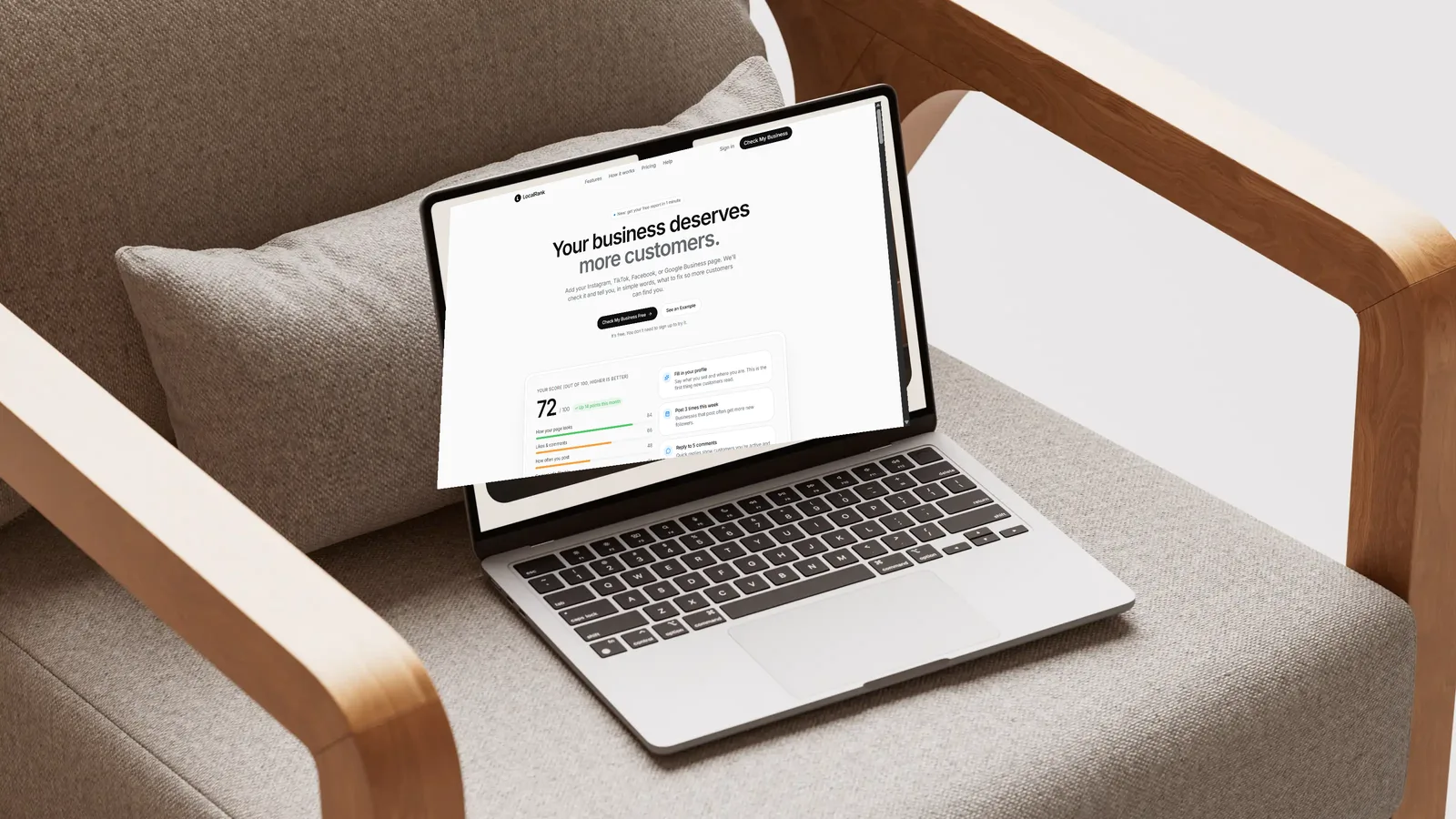 Laptop on an armchair showing the LocalRank website homepage