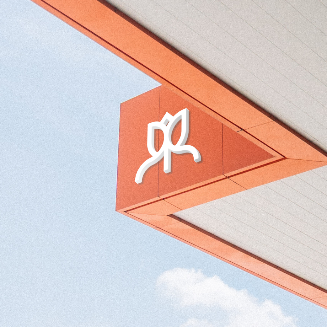 Roseview Realty logo sign mounted on a building corner against the sky